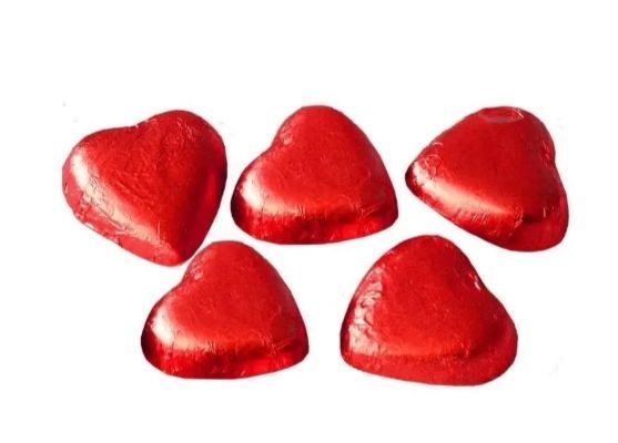 Серця з молочного шоколаду з вершковою начинкою Only Hearts в сітці 84 грами 026372 фото